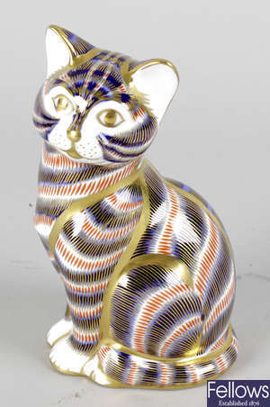 A Royal Crown Derby porcelain paperweight modelled as a seated kitten.