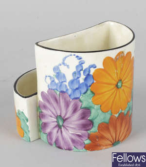 A Clarice Cliff Newport Pottery 'Bizarre' spill vase and match holder.