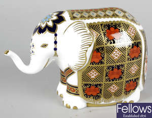 A Royal Crown Derby porcelain paperweight modelled as an elephant.
