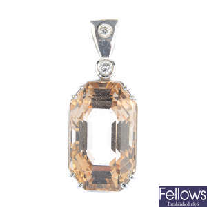 A topaz and diamond pendant.