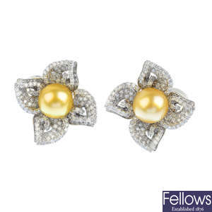 A pair of diamond and cultured pearl floral earrings.