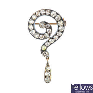 A late Victorian silver and gold, diamond question mark brooch.
