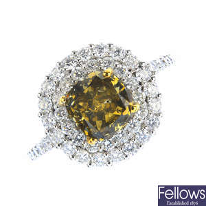 A Fancy Dark Brown-Greenish Yellow diamond and diamond cluster ring.