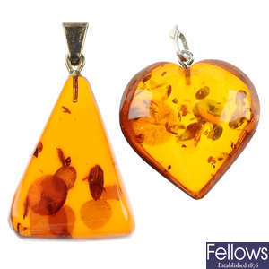 A selection of mainly modified amber jewellery in silver and white metal mounts.