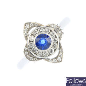 A platinum sapphire and diamond cluster ring.