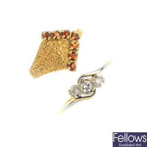 Two gem-set rings and a pair of sapphire and diamond earrings.
