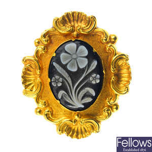 An mid Victorian gold onyx cameo mourning brooch.