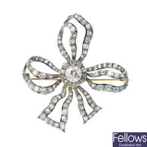 A late Victorian silver and gold diamond bow brooch.