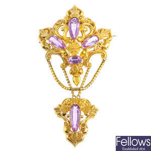An early Victorian gold topaz brooch.