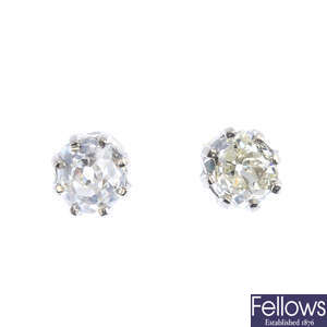 A pair of old-cut diamond single-stone stud earrings.