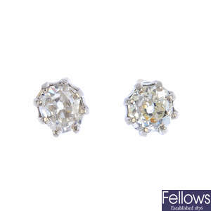 A pair of old-cut diamond single-stone stud earrings.