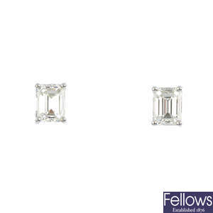 A pair of rectangular-shape diamond stud earrings.