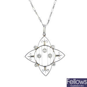 An Edwardian platinum and diamond pendant, with platinum chain.