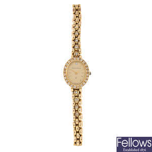 BUECHE-GIROD - a lady's 9ct yellow gold bracelet watch.