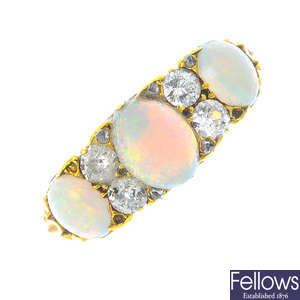 A late Victorian 18ct gold opal and diamond three-stone ring.