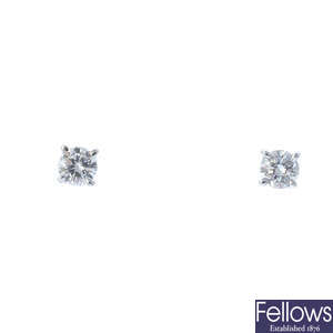 A pair of 9ct gold diamond stud earrings.