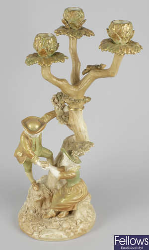 A Royal Worcester James Hadley porcelain figure group.