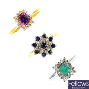 Three diamond, emerald, sapphire and garnet cluster rings.