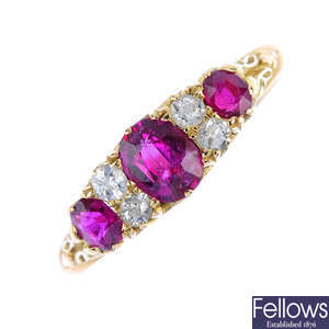 An early 20th century 18ct gold ruby three-stone and diamond ring.