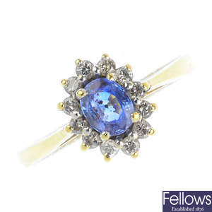 An 18ct gold sapphire and diamond cluster ring and a pair of diamond stud earrings.