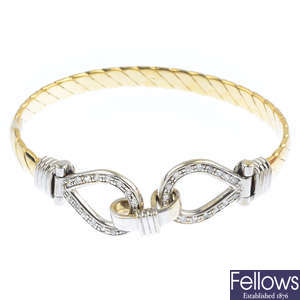 A 9ct gold cubic zirconia bangle.