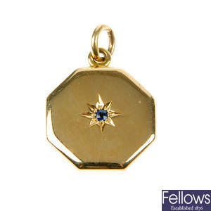 An early 20th century 15ct gold locket set with a sapphire.