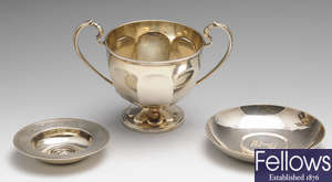 An early 20th century silver twin-handled cup & a selection of small modern silver items. (7).