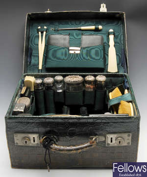 A matched and part Edwardian travelling vanity set.
