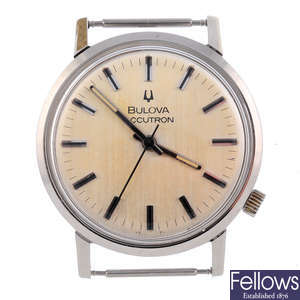 BULOVA - a gentleman's stainless steel Accutron watch head with two Bulova watches and a Bulova movement.