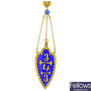 An early 20th century gold enamel pendant.