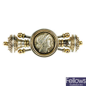 An Etruscan gold and silver brooch.