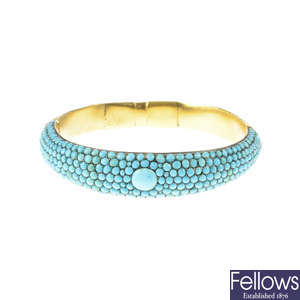 A late Victorian gold and turquoise hinged bangle.