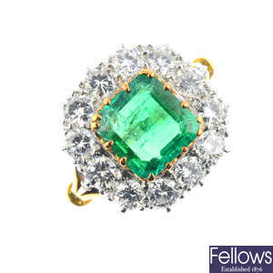 An 18ct gold Colombian emerald and diamond cluster ring.
