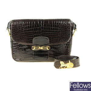 CÉLINE - a vintage crocodile handbag with matching belt.