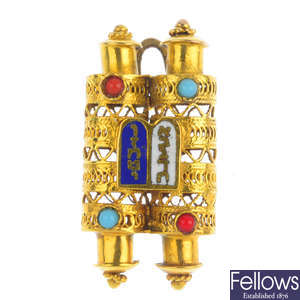 An enamel and gem-set Torah pendant.