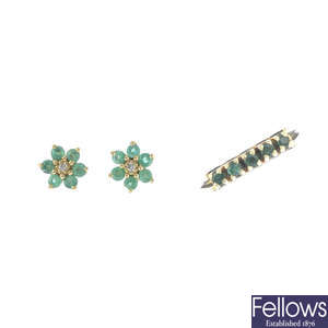 An emerald five-stone ring, and a pair of emerald and diamond earrings.