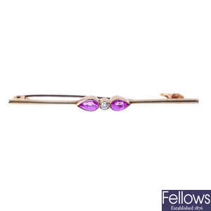 An early 20th century gold diamond and synthetic pink sapphire brooch.