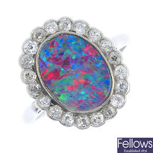 An early 20th century platinum, opal doublet and diamond cluster ring.