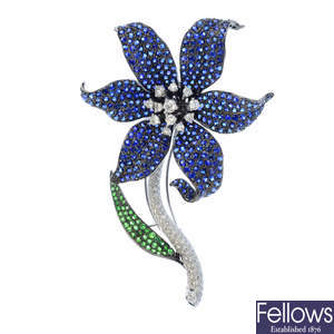 A diamond, sapphire and tsavorite garnet floral brooch.