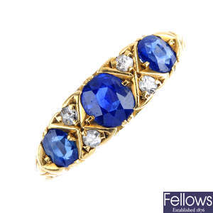An Edwardian 18ct gold sapphire three-stone and diamond ring.