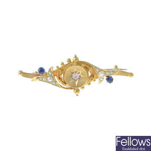 An Edwardian 15ct gold diamond and gem-set bar brooch.