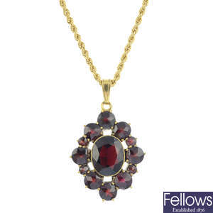 A garnet pendant, with chain.