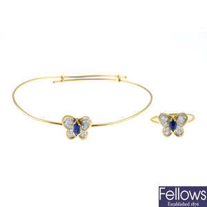 A sapphire and diamond butterfly bangle and a ring.