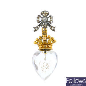 A rock crystal and diamond crowned heart pendant.