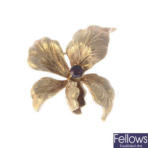A mid 20th century 9ct gold garnet flower brooch.