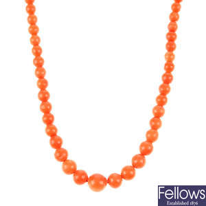 A coral necklace with 18ct gold clasp.