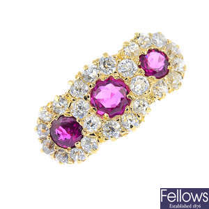 A late Victorian 18ct gold ruby and diamond triple cluster ring.