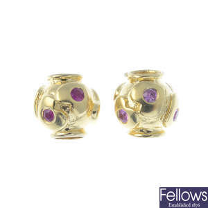 TROLLBEADS - two 18ct gold 'Heartbeat' gem-set charms.