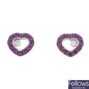CHOPARD - a pair of 18ct gold ruby and diamond 'Happy Diamonds' earrings.