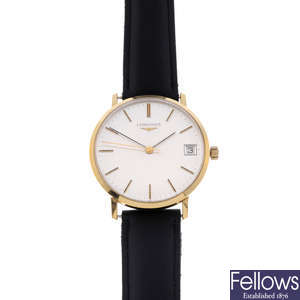 LONGINES - a gentleman's gold plated wrist watch with two Longines watches.